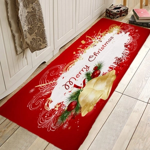 Close-up of red flannel Christmas floor mat with gold bells on light wood floor