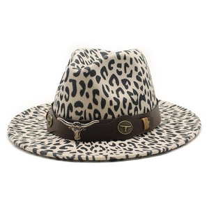 Classic leopard print felt fedora with a bull head buckle and leather strap on white background