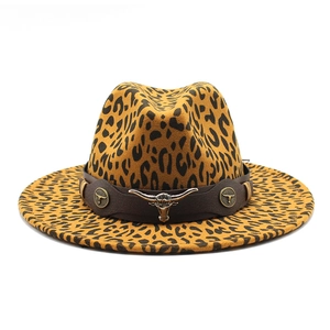 Detail of leopard print fedora with vintage bull head metal ornament and brown band