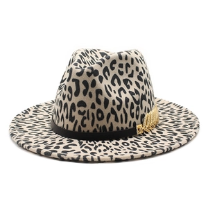 Detail of leopard print fedora hat featuring black leather band and gold leaf metal chain