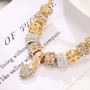 Golden Pandora style snake chain bracelet with heart pendants and crystal beads