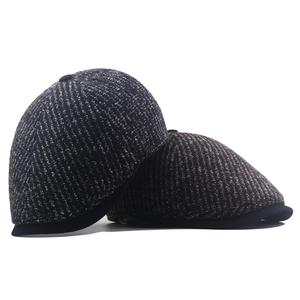 Winter knitted ivy caps for men in black grey and brown mixed colors on white background