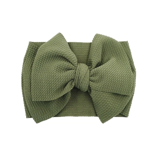 Detailed view of large olive green waffle knit bow headband for infants and kids