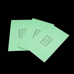 Three-pack light green silver polishing cloths for jewelry maintenance on black background