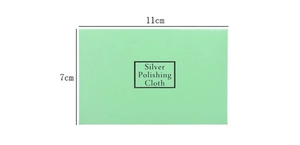 Macro detail of a light green silver polishing cloth measuring 11cm x 7cm for jewelry care