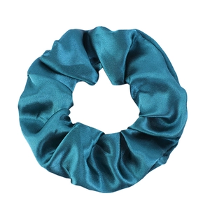 Elegant lake blue satin scrunchie with silk texture and glossy finish for hair styling