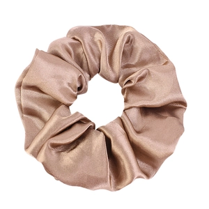 Elegant champagne satin scrunchie with smooth silk texture and high elastic pleated design