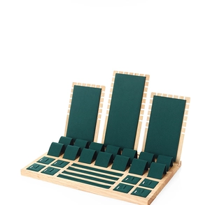 Bamboo and green velvet jewelry display set featuring necklace stands and ring slots