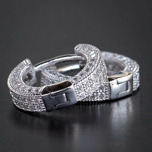 Elegant silver huggie earrings with multiple rows of pavé micro-set cubic zirconia crystals