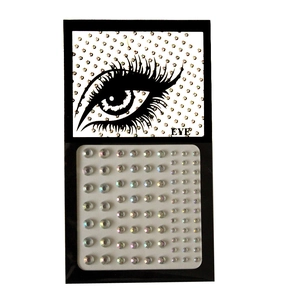 Detailed macro of multi-size self-adhesive crystal gems on clear backing for face and eyes