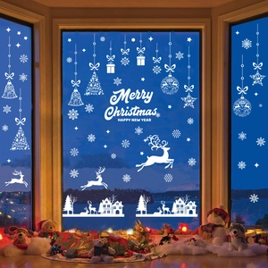 White Christmas window decals with reindeer, snowflakes, and festive Merry Christmas text