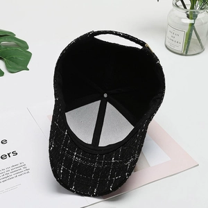 Classic black and white tweed baseball cap with adjustable metal buckle and inner lining