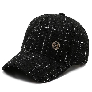 Fashionable black and white tweed baseball cap with a gold M emblem for men and women