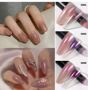 Detail view of chrome nail powder in pink and purple shades with application tools
