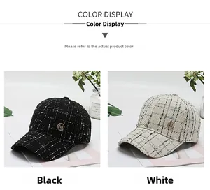 Detail of tweed checkered baseball caps in black and white with gold M metal logo