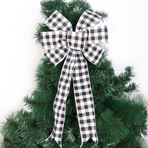 Large black and white gingham Christmas tree topper bow with handmade fabric texture