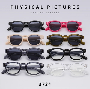 Detailed grid of retro round sunglasses in eight colors with stylish metal rivet accents