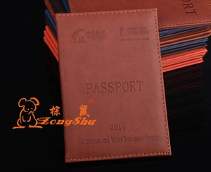 Close-up of brown PU leather passport holder with secure buckle and internal card slots