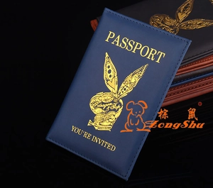 Detail of navy blue PU leather passport cover with gold foil logo and card slots