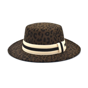 Close-up of leopard print fedora hat featuring thick wool felt and striped ribbon band