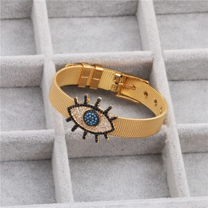 Golden mesh strap bracelet with evil eye charm featuring colorful cubic zirconia