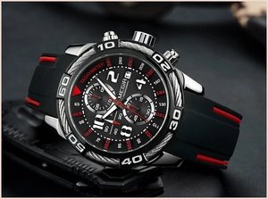 Detail view of MEGIR chronograph watch dial with silver indices and red accents