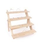 Macro detail of a 4-tier wooden jewelry display stand for rings and earrings