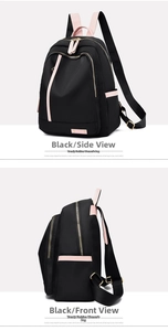 Detalle de la mochila oxford negra con correas de cuero rosa y cremalleras de metal dorado