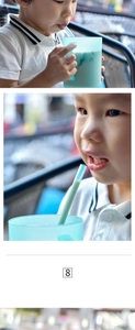 Detail of light blue baby water cup with handle and flexible food-grade silicone straw