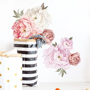 Detail of pink and white watercolor peony wall stickers on a clean white interior wall