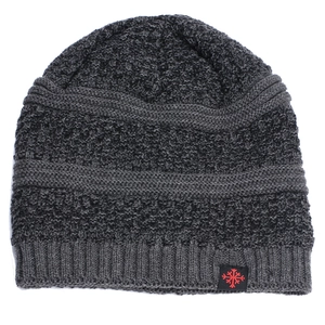 Detailed close-up of dark grey thick knit beanie featuring a red snowflake patch