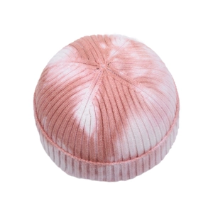 Detailed view of pink and white tie-dye ribbed knit beanie with rolled brim design