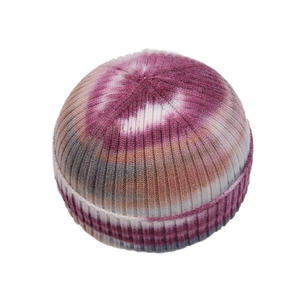 Knit tie-dye docker hat in pink and khaki colors with ribbed texture and folded brim