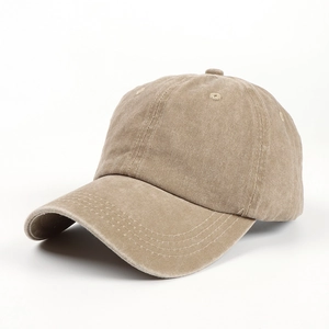 Detail of khaki vintage washed cotton baseball cap showing curved brim and stitch lines