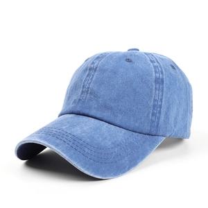 Detail showing the vintage washed blue cotton fabric and reinforced stitching on the cap