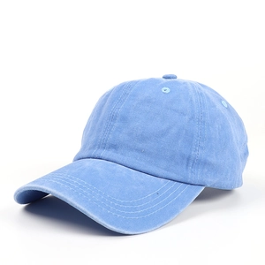 Detail of light blue washed cotton baseball cap with reinforced stitching on the brim