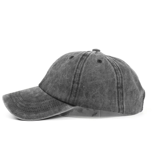 Side view of dark gray washed cotton baseball cap with vintage worn finish and curved brim