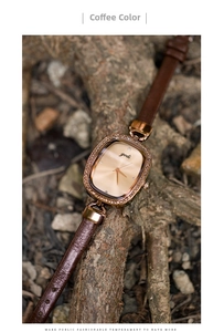 Detail of coffee leather strap and rose gold rectangular case with crystal bezel