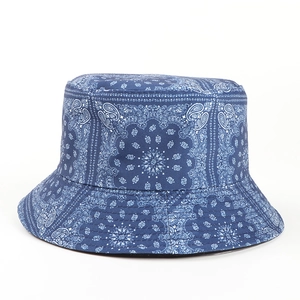 Detail of dark blue bucket hat with white paisley pattern and durable fabric texture