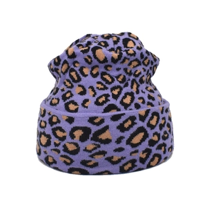 Detail of light purple leopard print knitted beanie with wide cuff and premium wool texture