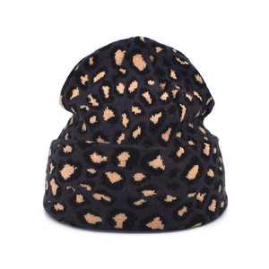 Detailed close-up of leopard print knit beanie with a classic folded cuff texture