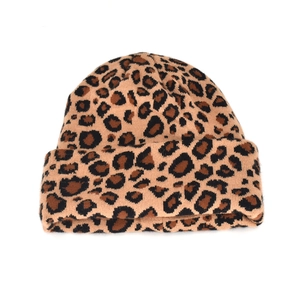 Close-up of leopard print knit beanie showing soft wool texture and wide cuffed design
