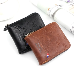Detail of embossed texture and signature tri-color ribbon on men's zipper wallet