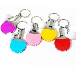 Mini table tennis racket keychains in five colors with small white balls and metal rings
