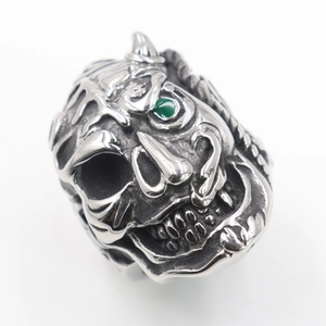 Vintage punk stainless steel skull ring with green gemstone eyes and antique silver finish