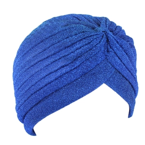 Detail of bright blue turban with metallic glitter finish and elegant pleated design