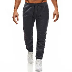 Men's dark grey fleece joggers with elastic drawstring waist and slim fit ribbed cuffs