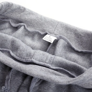 Deep grey fleece-lined jogger pants with elastic drawstring waist and premium texture