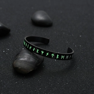 Black titanium steel Viking bangle with luminous green runes and adjustable open design
