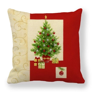 Close-up of linen pillow cover with festive Christmas tree and gold scroll patterns